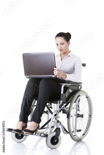 Photo: Attractive smiling disabled businesswoman Attractive smiling disabled businesswoman