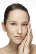 Beautiful young woman with clean skin of the face.