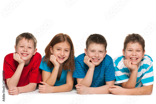 Photo: Four children are lying on the floor Four children are lying on the floor