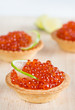 Tartlets with red caviar and lime