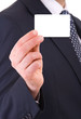 Business man showing blank card.