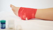Video: Doctor bandaging a patient's foot who is with in medical office. Doctor bandaging a patient's foot who is with in medical office.