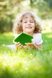 Child holding eco house