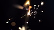 a sparkler being ignited making abstract pattern in slow motion