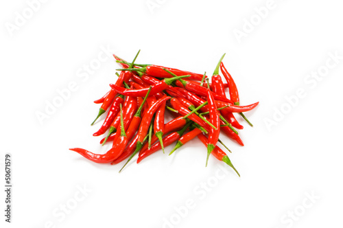 Photo: Red chili peppers isolated on the white Red chili peppers isolated on the white