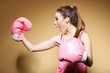 Female boxer model with big fun pink gloves