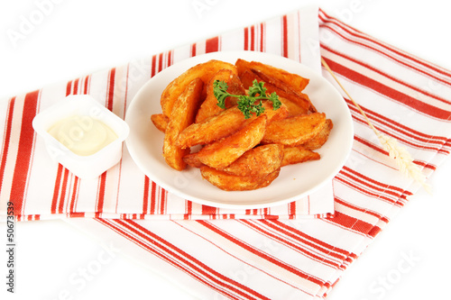Photo: Appetizing village potatoes on plate isolated on white Appetizing village potatoes on plate isolated on white