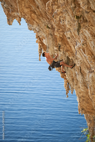 Photo: Rock climber on a cliff Rock climber on a cliff