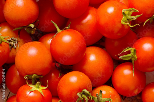 Photo: Many red tomatoes arranged at the market Many red tomatoes arranged at the market