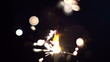 a sparkler being ignited making abstract pattern in slow motion