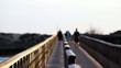 Man runing across wooden bridge