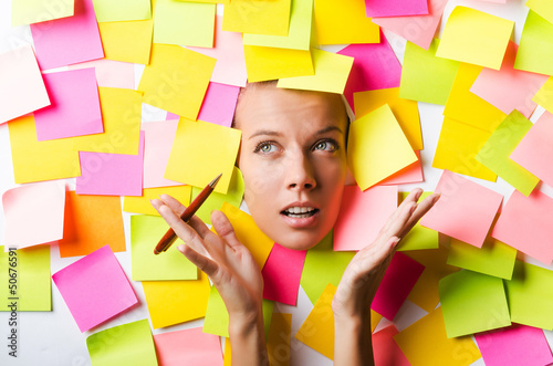 Photo: Businesswoman with lots of reminder notes Businesswoman with lots of reminder notes
