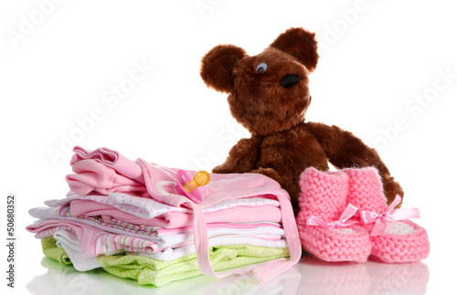 Photo: Pile of baby clothes isolated on white Pile of baby clothes isolated on white