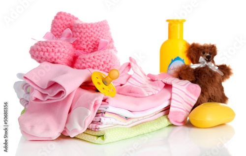 Photo: Pile of baby clothes isolated on white Pile of baby clothes isolated on white