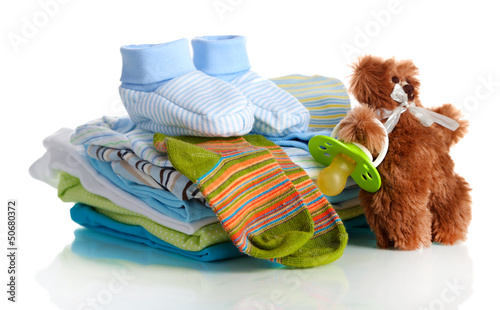 Photo: Pile of baby clothes isolated on white Pile of baby clothes isolated on white