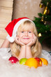 The girl under the Christmas fir-tree