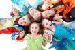 Four laughing girls and one boy, dressed in fancy dress