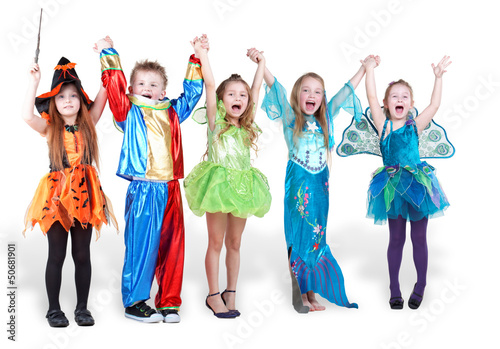 Photo: Children stand holding hands and lifting them up and shout Children stand holding hands and lifting them up and shout
