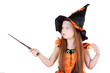 Little girl in orange costume of witch for Halloween holds wand