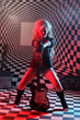 Photo: Young woman is leaning on electric guitar in studio Young woman is leaning on electric guitar in studio
