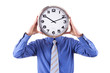 Young businessman with analog clock over his face. Deadline