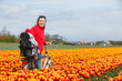 Family on bikes in spring flower fields