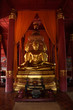 The sitting gold buddha in chapel