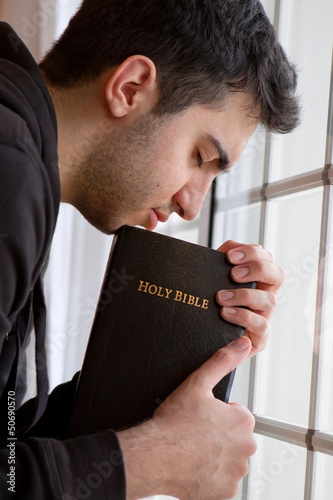 Photo: Man Praying by Window Man Praying by Window