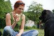 Foto: Young woman playing with her dog Young woman playing with her dog