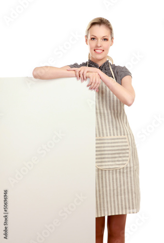 Photo: A smiling woman wearing apron and posing A smiling woman wearing apron and posing