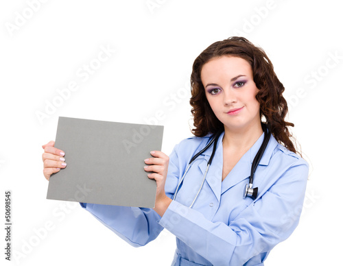 Photo: Smiling medical doctor holding blank clipboard Smiling medical doctor holding blank clipboard
