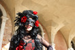 Venetian costume attends Carnival of Venice.