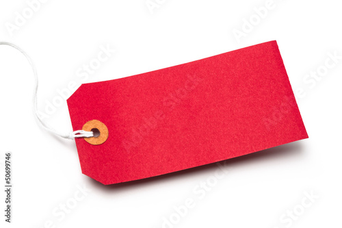 Photo: Red cardboard or paper luggage tag isolated on white Red cardboard or paper luggage tag isolated on white