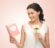 young woman holding flower and postcard