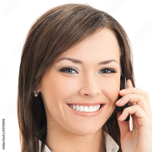 Photo: Happy businesswoman with cell phone, isolated Happy businesswoman with cell phone, isolated