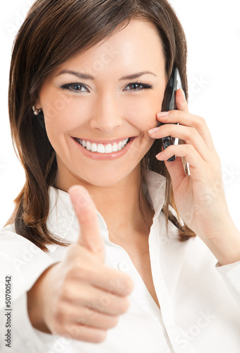Photo: Happy smiling businesswoman with cell phone Happy smiling businesswoman with cell phone