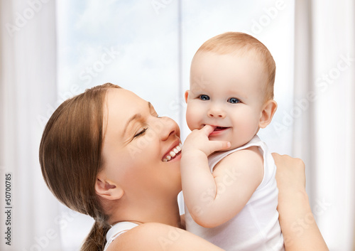 Photo: happy mother with adorable baby happy mother with adorable baby