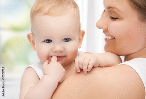 Photo: happy mother with adorable baby happy mother with adorable baby