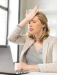 businesswoman holding her head with hand