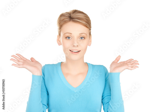 Photo: woman shrugging or doubting woman shrugging or doubting