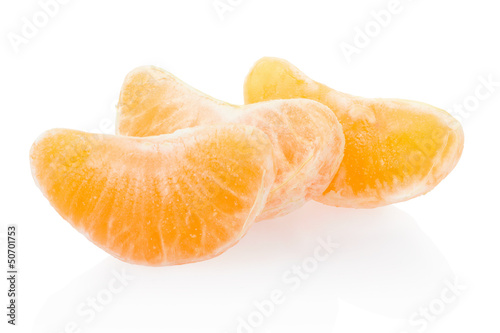 Photo: Tangerine, orange segments on white, clipping path Tangerine, orange segments on white, clipping path