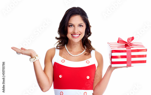 Photo: Beautiful young girl with a Christmas present. Beautiful young girl with a Christmas present.