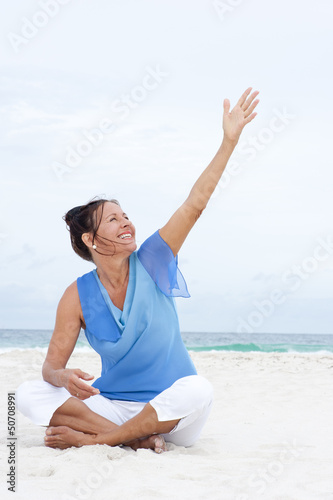 Photo: Portrait cheerful mature woman beach Portrait cheerful mature woman beach