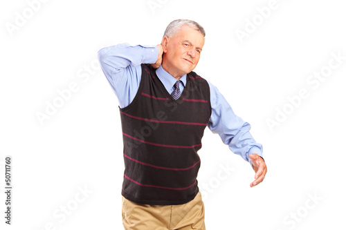 Photo: A gentleman suffering from a neck pain A gentleman suffering from a neck pain
