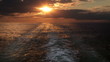 Sunset and wake of a ship