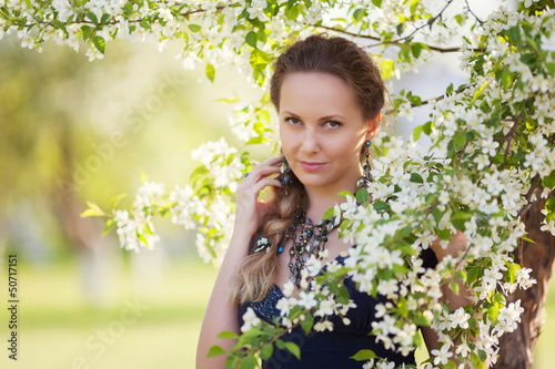 Photo: Beautiful woman in a spring garden Beautiful woman in a spring garden