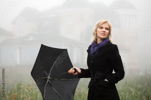 Photo: Young woman in autumn foggy morning Young woman in autumn foggy morning