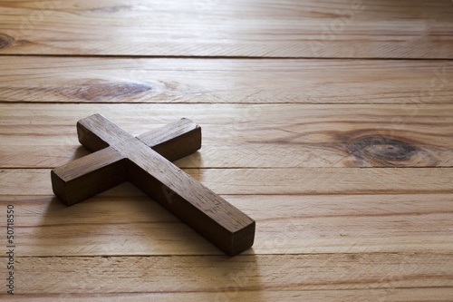 Photo: Cross over wood table with window light Cross over wood table with window light
