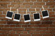 Blank photos over bricl wall with clipping path for the frames