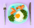 Sausages in form of hearts, scrambled eggs and parsley,